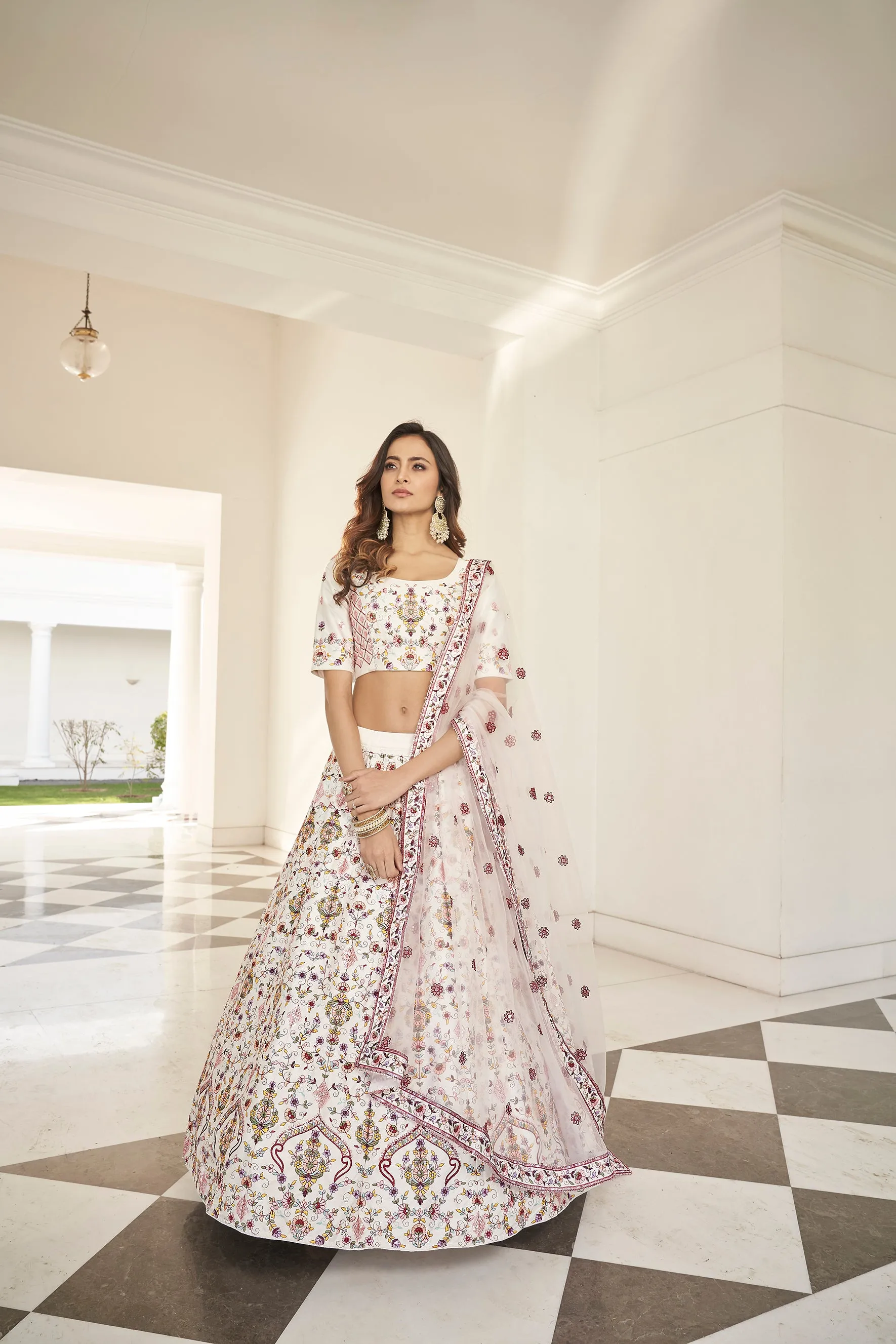 Fascinating White Embroidered Silk Party Wear Lehenga Choli